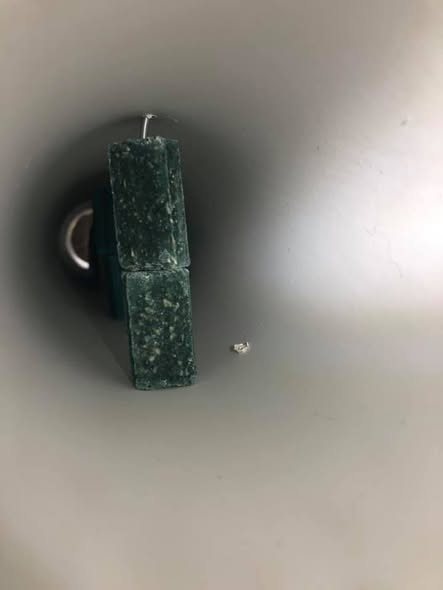 Bait secured inside a locked, tamper-proof station